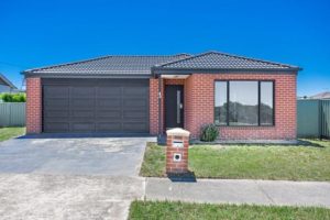 Small red brick home with dark grey roof designed by Geelong structural engineer